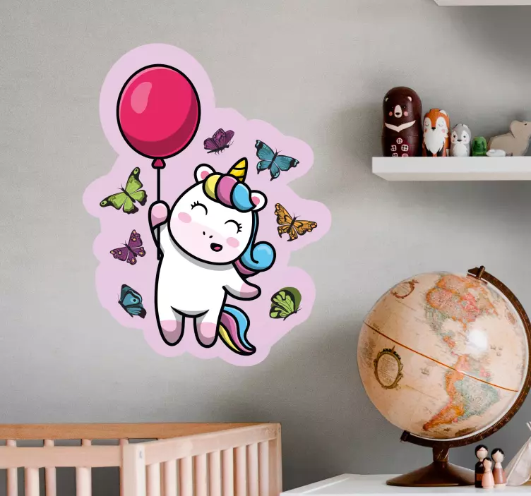 Vinilo pared infantil unicornio juguetón con globo - TenVinilo